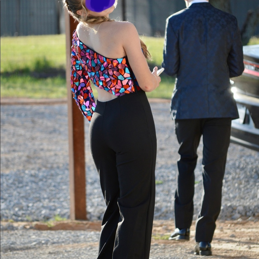 This is a beautiful and unique prom outfit. Sherri Hill jumpsuit.
